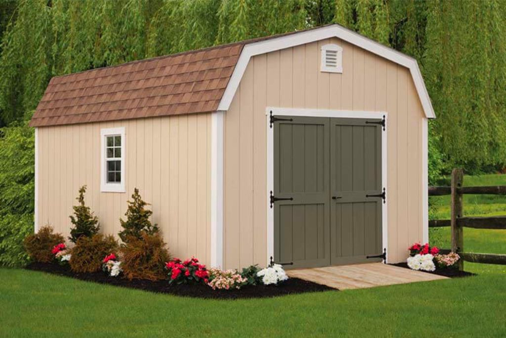 Top rated outdoor shed with beige siding and flowers in front of fence