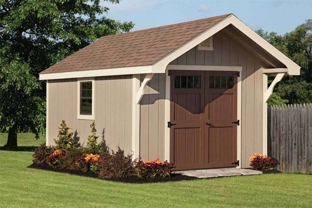 Tan and brown rustic shed on lawn