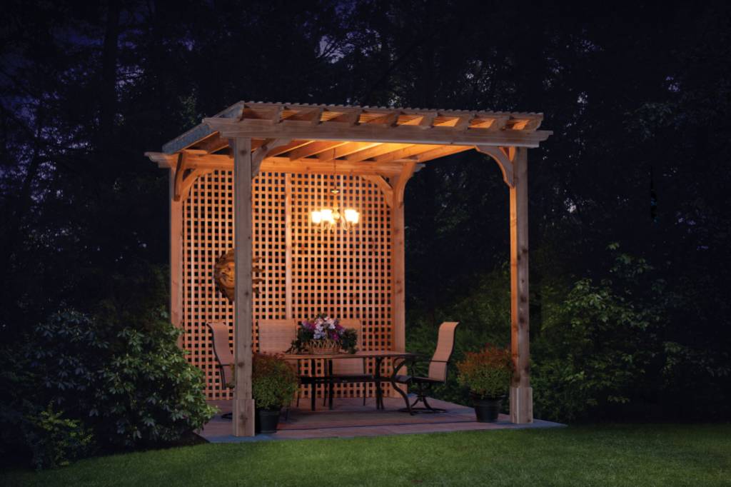 outdoor living ideas pergola warmly lit during the night