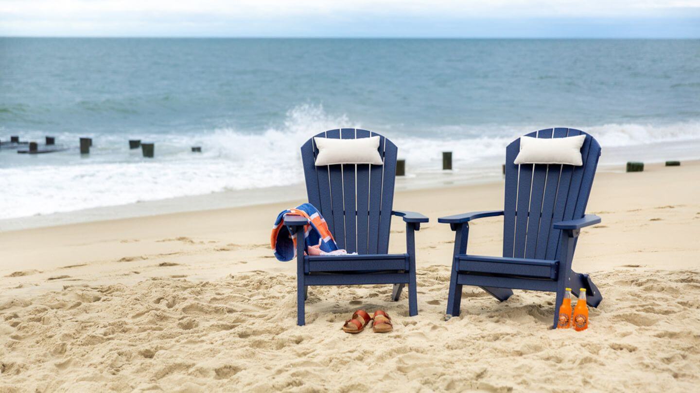 navy amish outdoor furniture in adirondack chair style on a beach